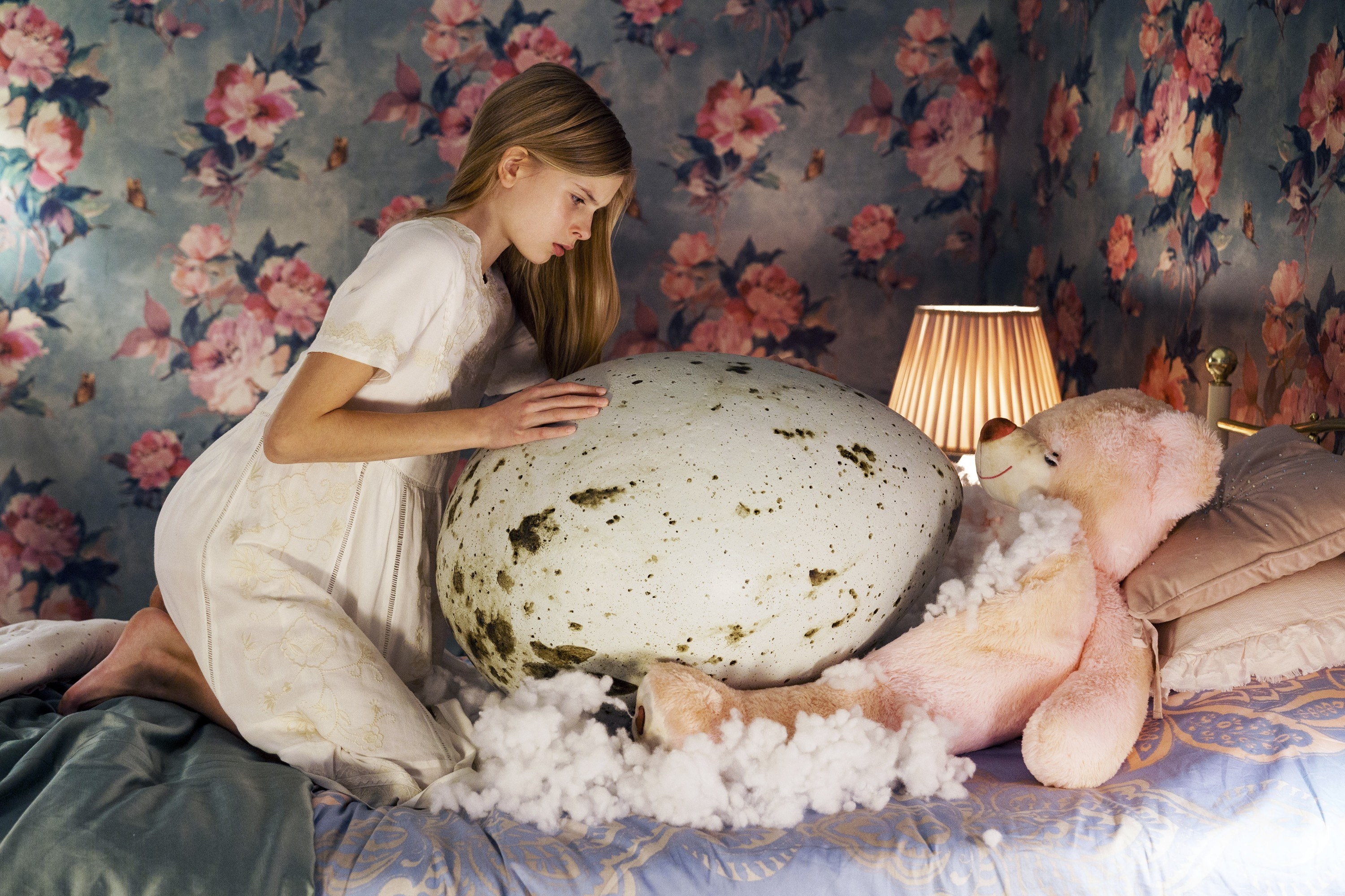 Siiri Solalinna sits in bed with a giant egg