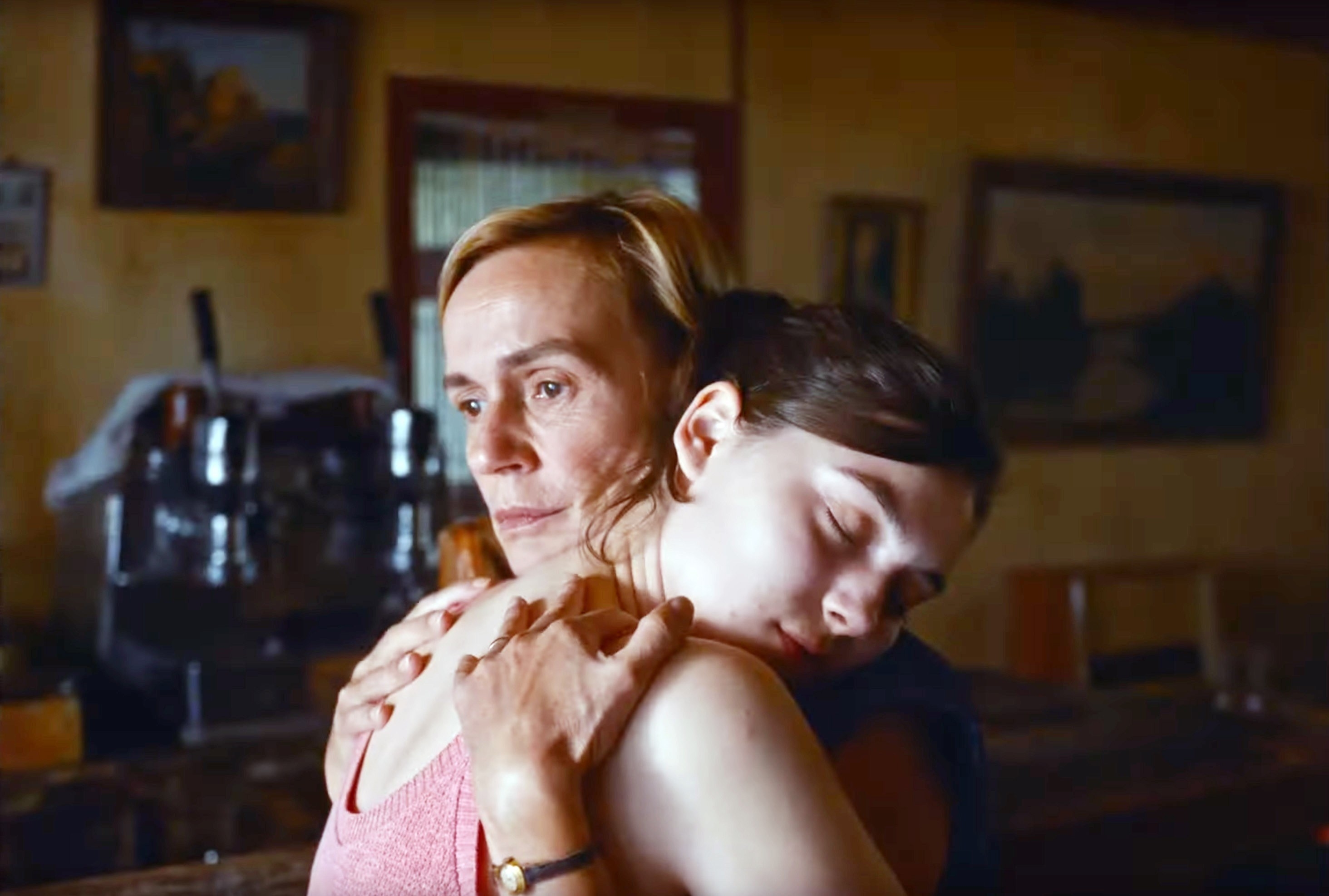 Sandrine Bonnaire and Anamaria Vartolomei hug one another