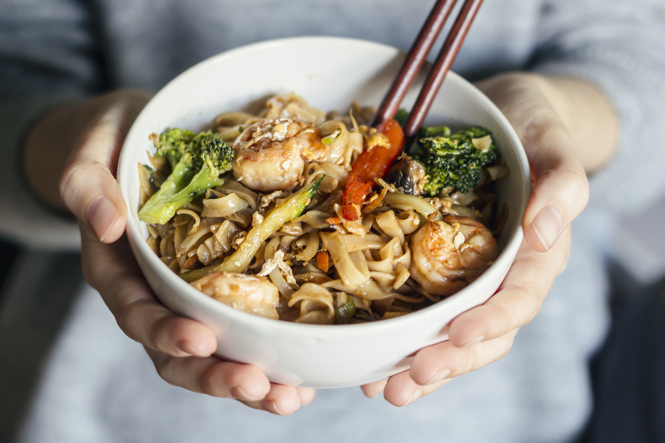 A bowl of shrimp and vegetable noodles