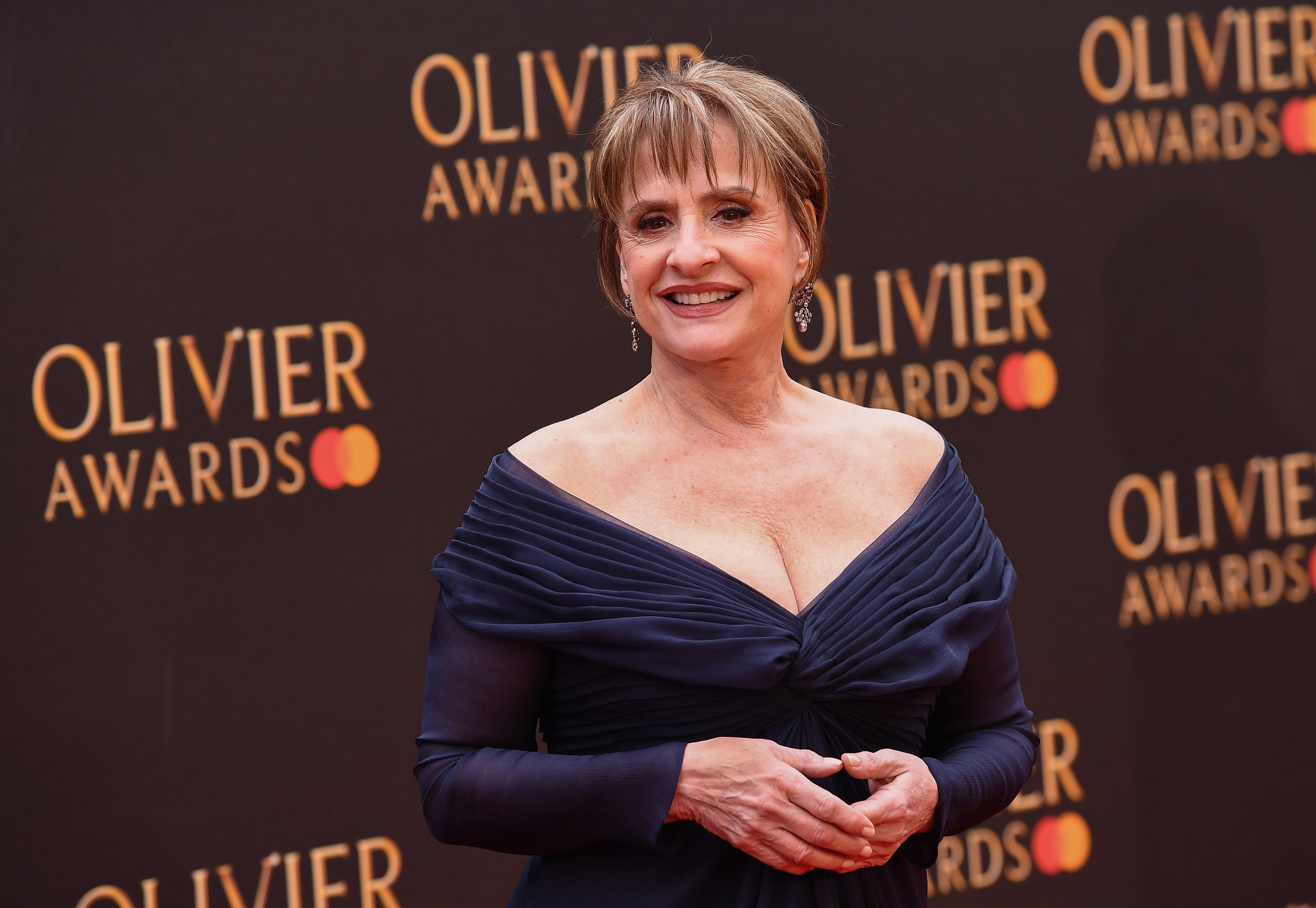 Patti LuPone smiling on the red carpet