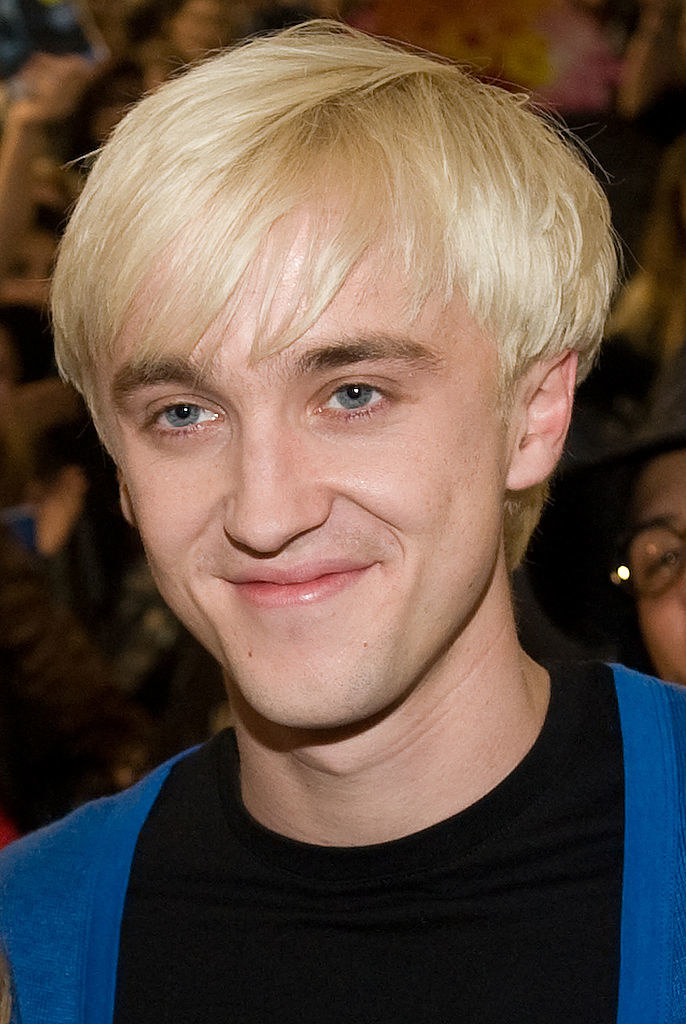 Tom, who is a brunette, with the infamous blond hair