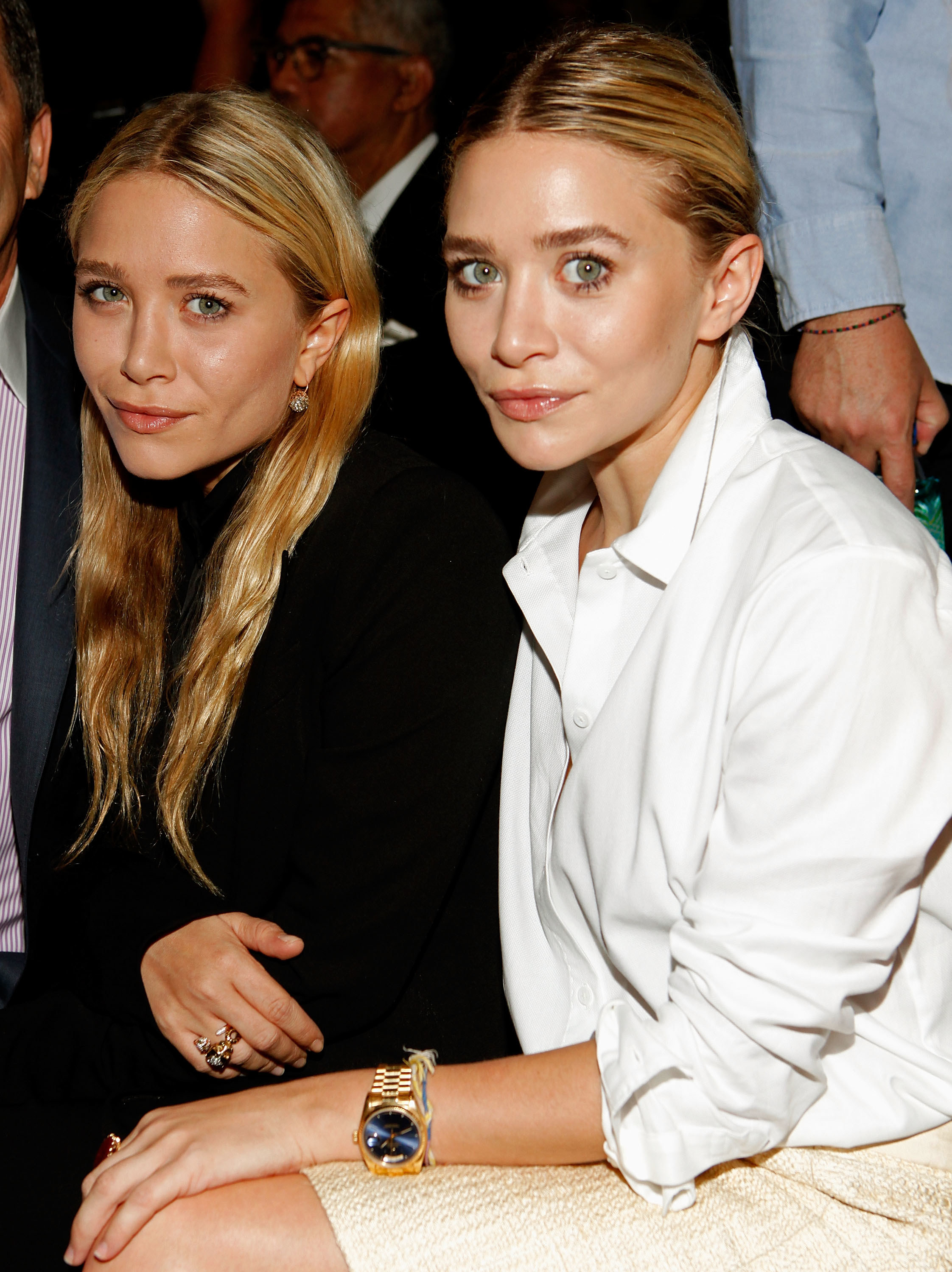 The Olsen twins sitting together