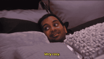 A gif of Tom from Parks and Rec saying &quot;very cozy&quot;