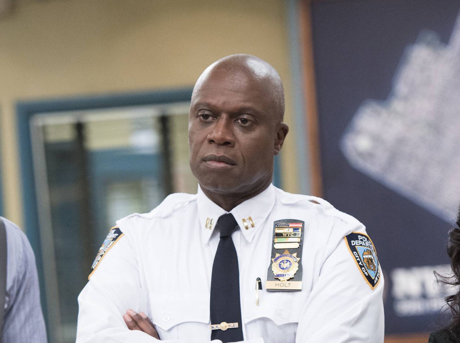 Captain Holt looking serious with his arms crossed