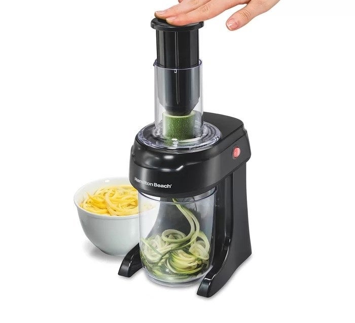 a photo of the spiralizer making noodles of zucchini