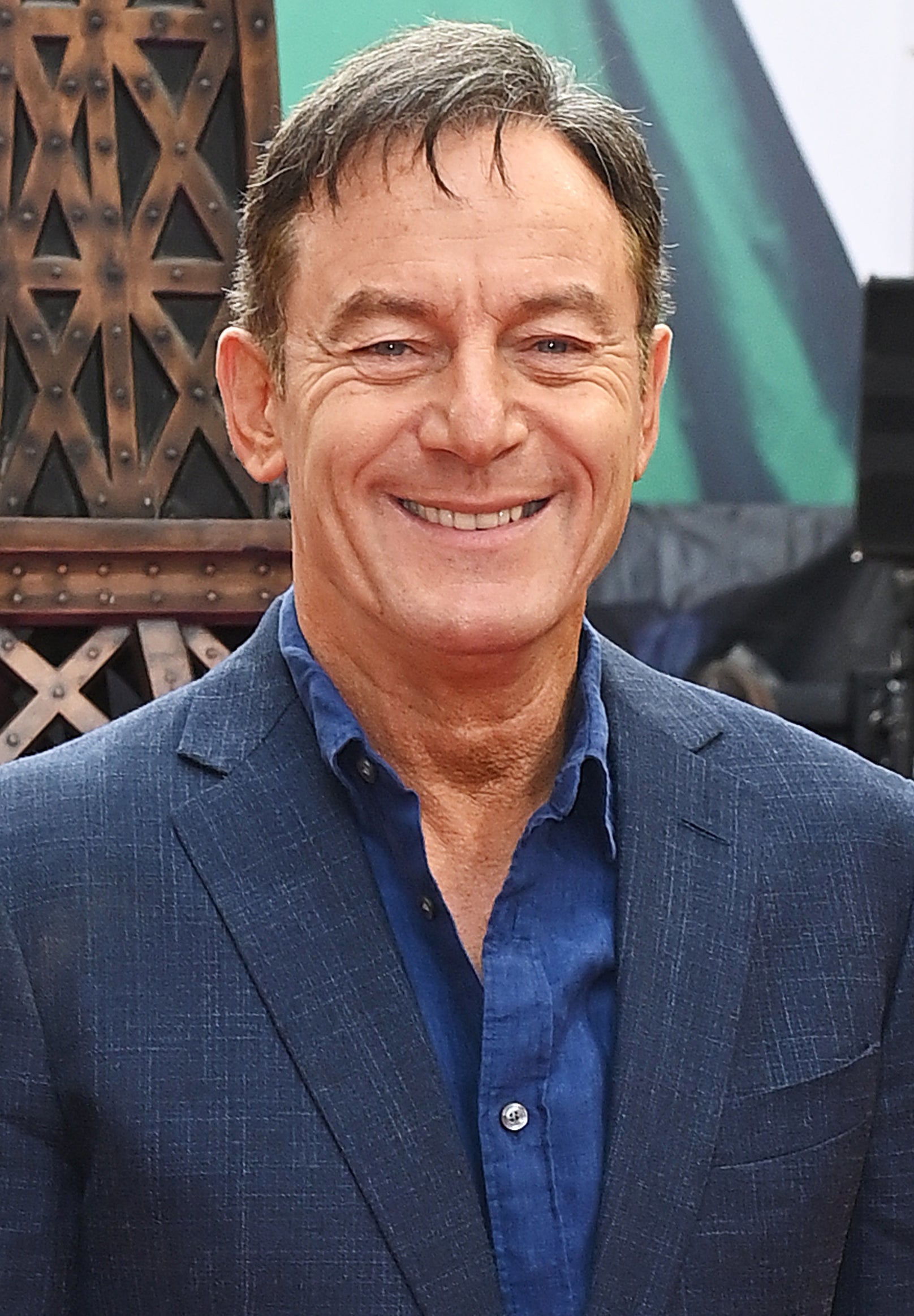 closeup of Jason Isaacs smiling