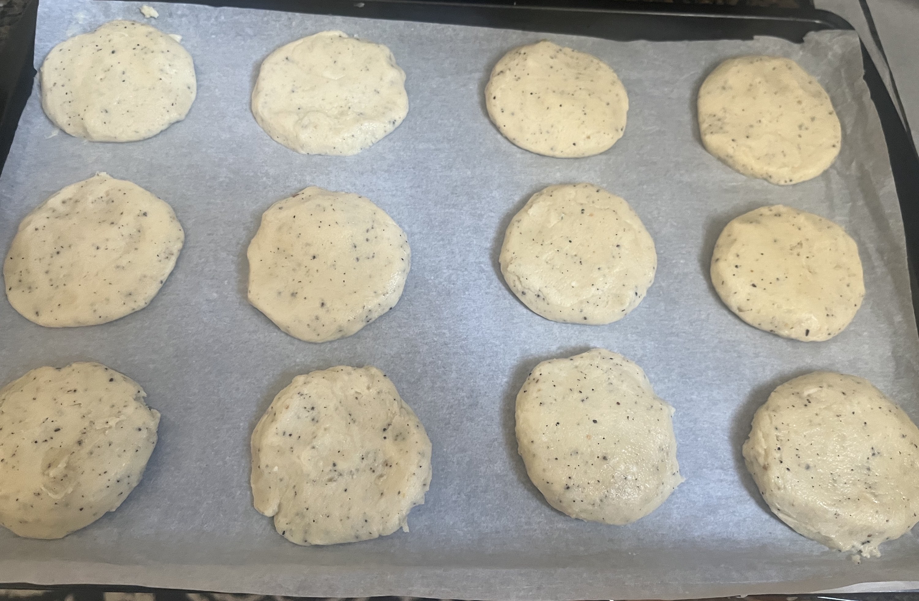 the flattened balls of dough on a cookie sheet