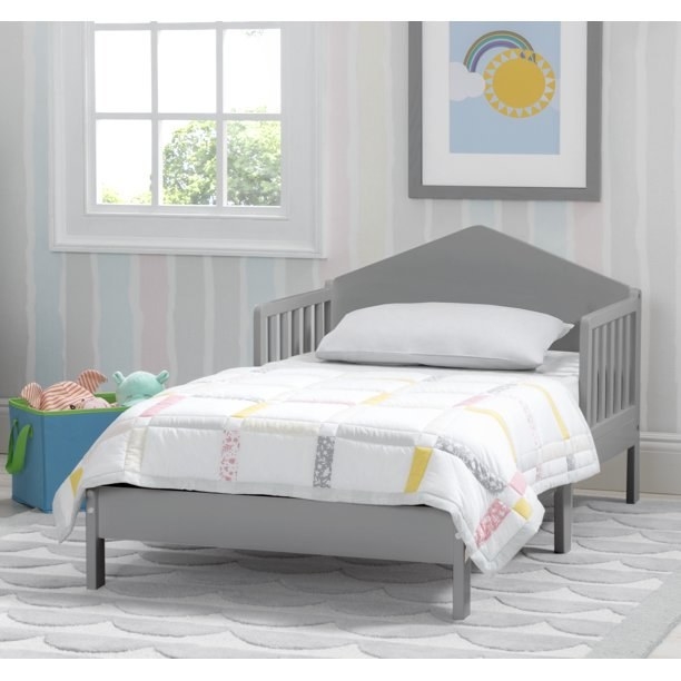 Grey toddler bed in kids room