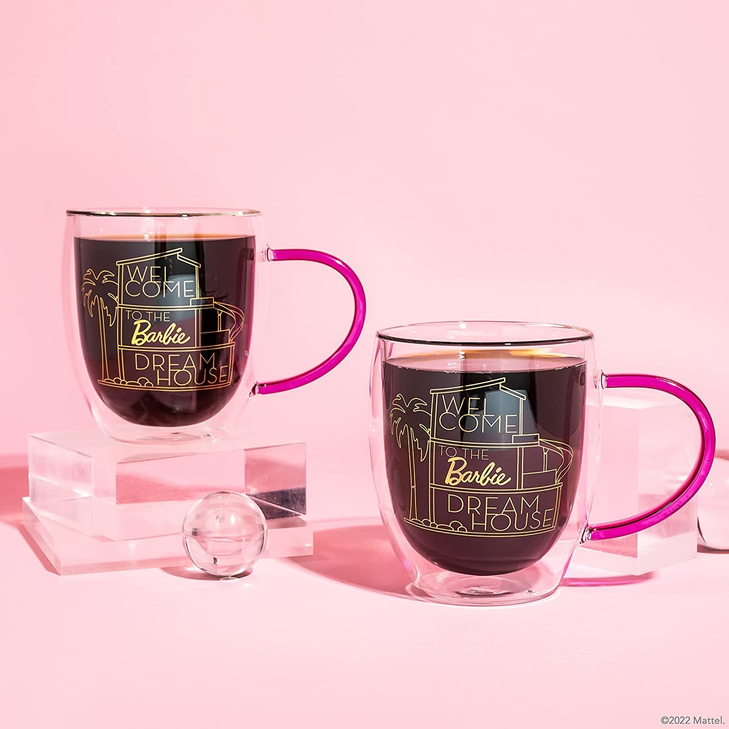 The coffee cups with malibu dreamhouse design and pink handles