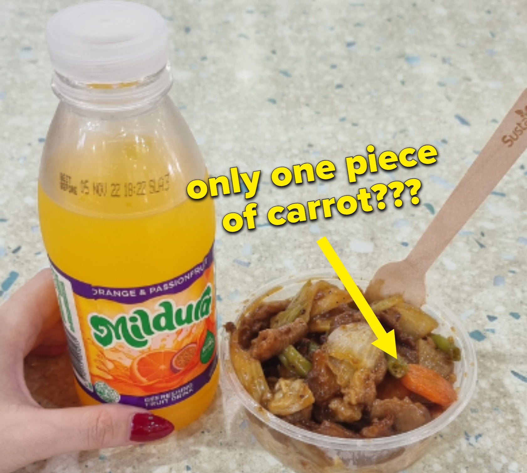 A bottle of juice and a small serving of stir-fry in a takeout container; there is an arrow and text saying &quot;only one piece of carrot?&quot;