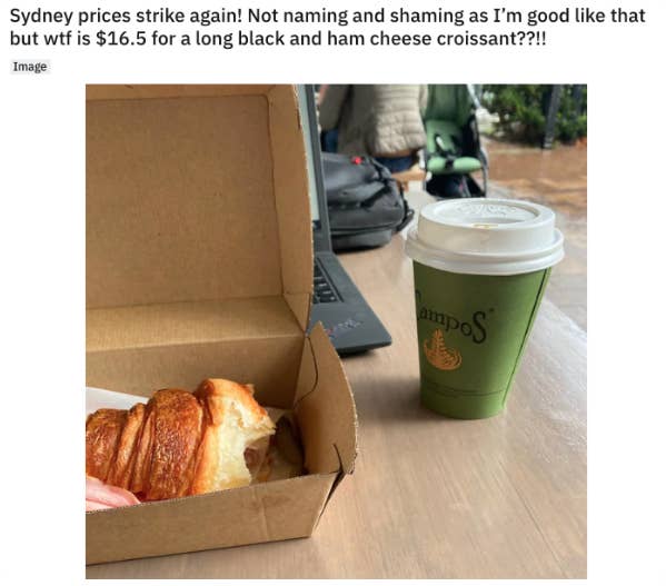 A photo showing a croissant and coffee which cost $16.50