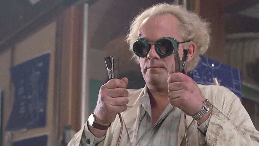 Christopher Lloyd as &quot;Doc&quot; in &quot;Back to the Future&quot; holding two electrical wires