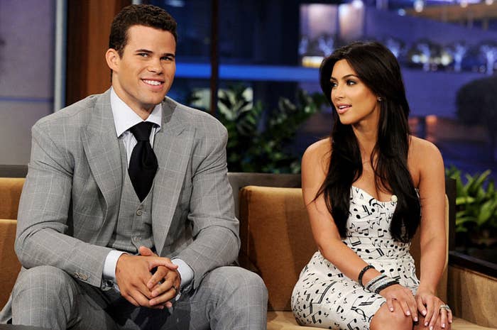 Kim sitting with Kris Humphries on a chat show
