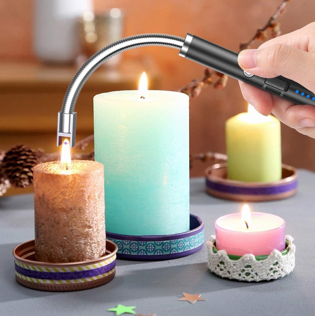 someone using the lighter to light a candle