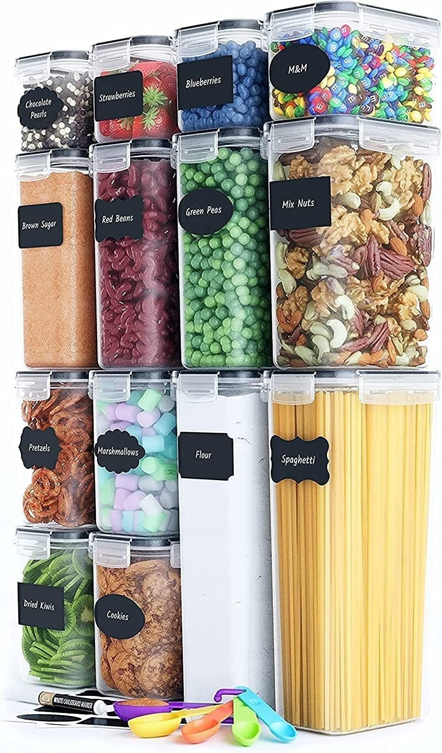 14 containers with snap on lids, labels, and a set of measuring spoons