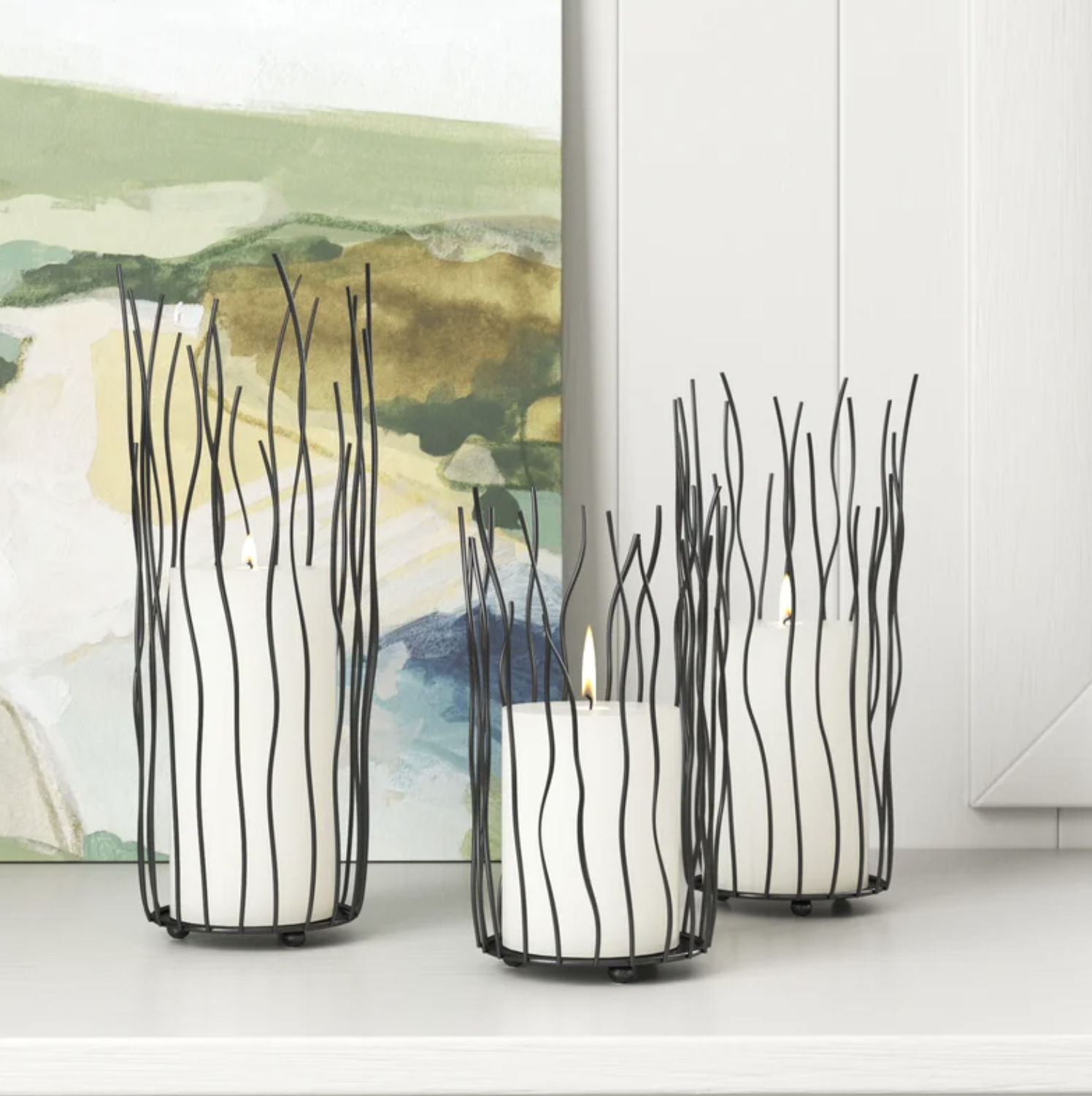 the three wire framed candle holders