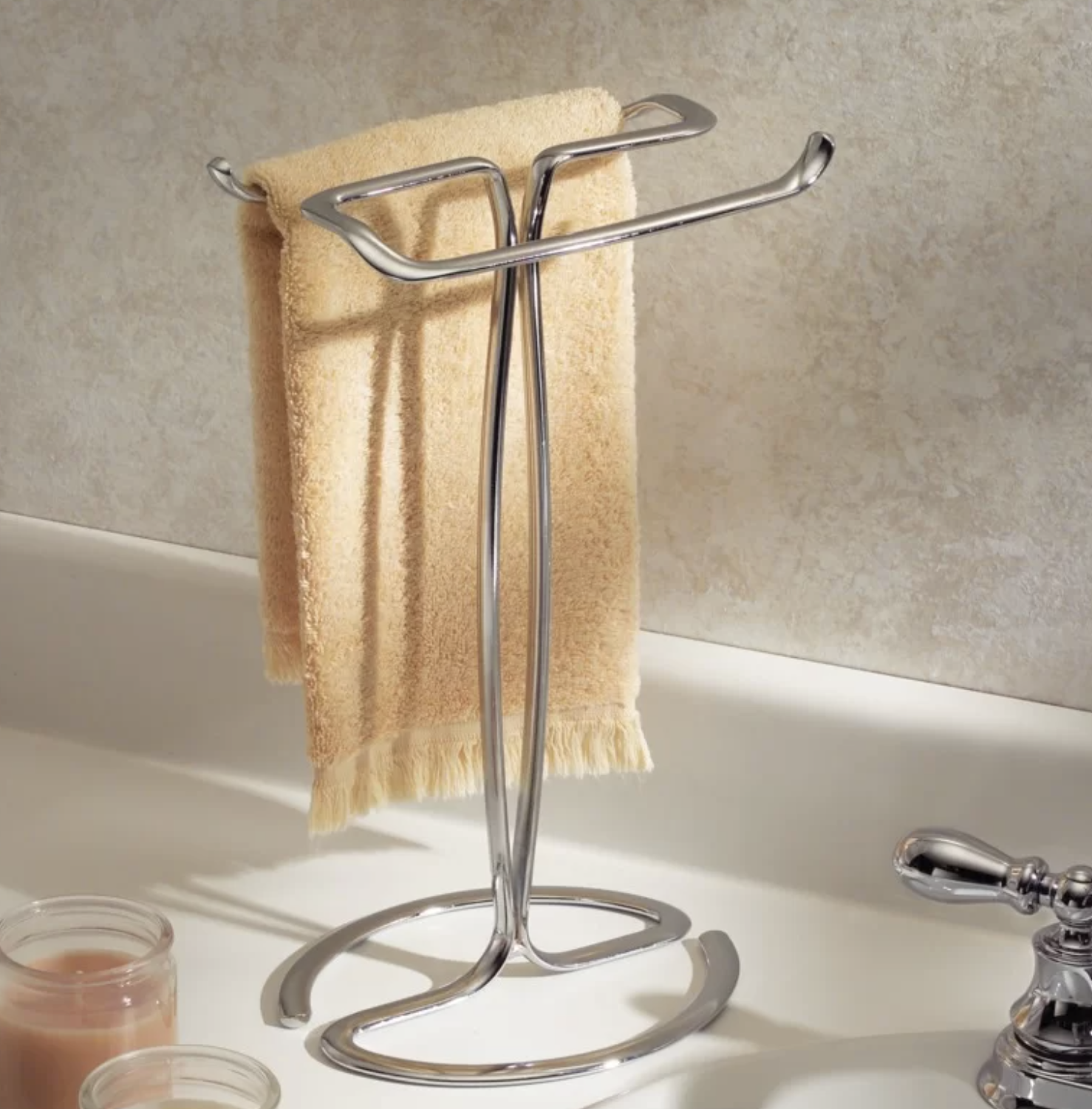 the towel rack holding a hand towel