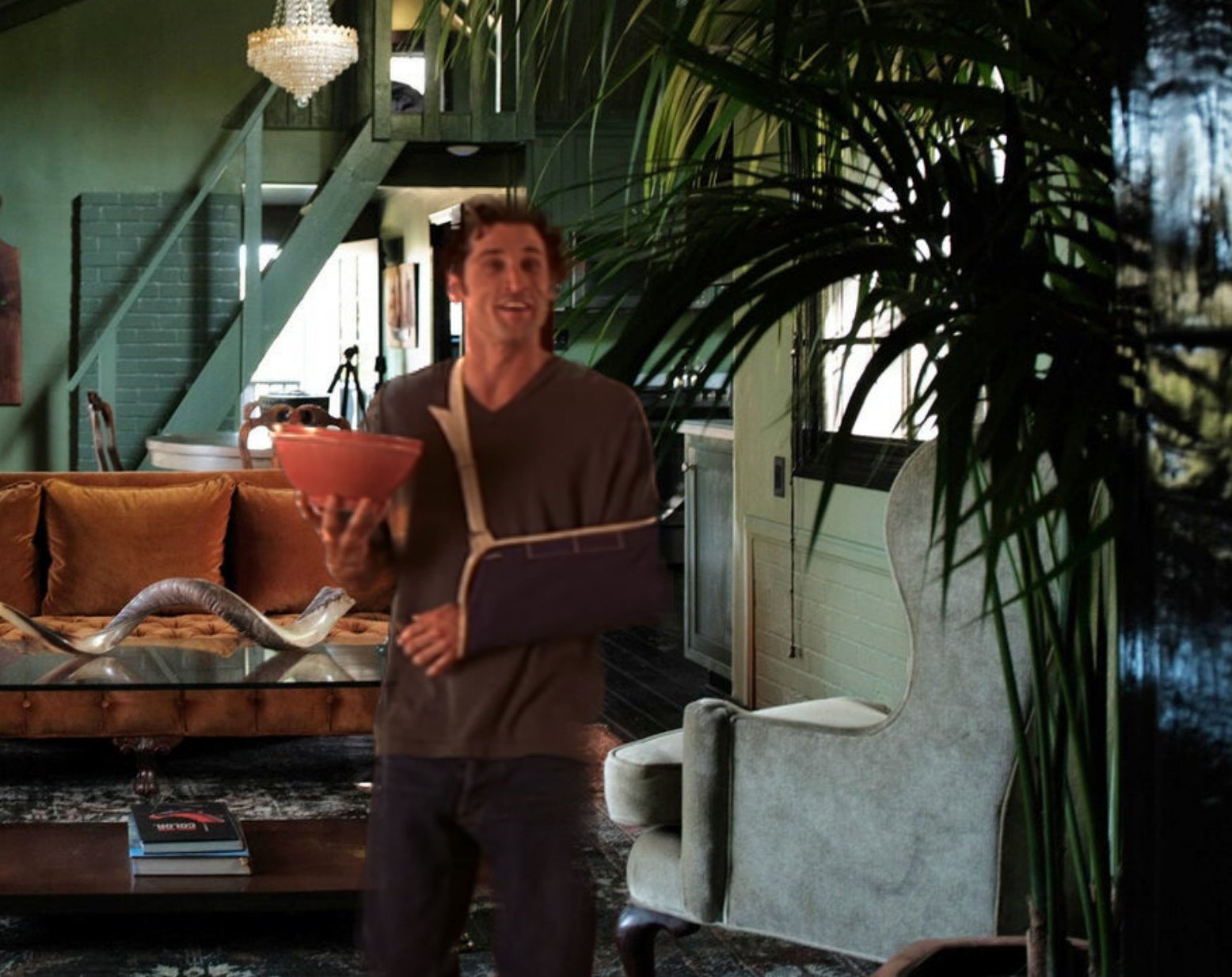 photoshopped version of said living room with patrick dempsey in it holding the bowl of popcorn