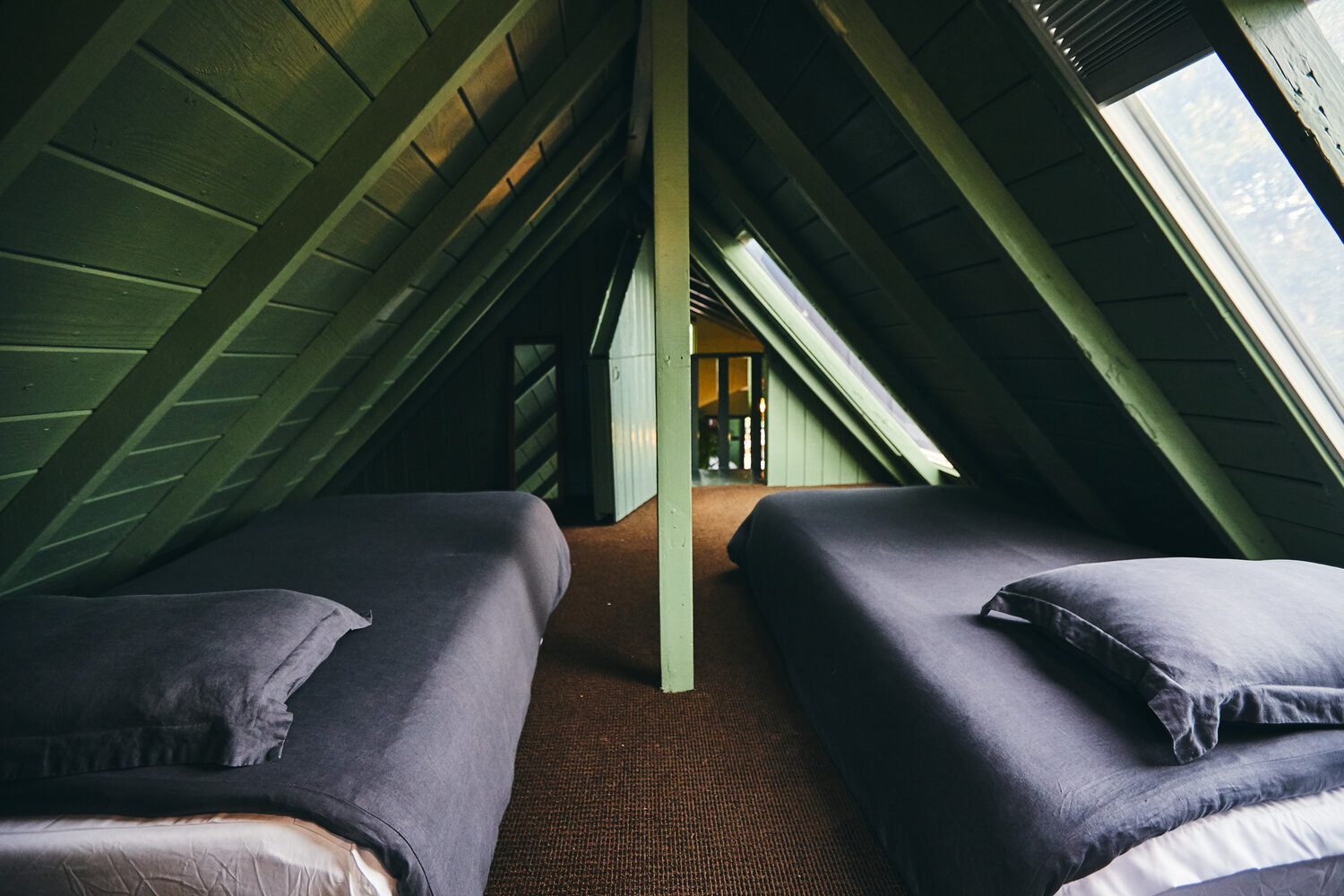 sleeping loft with two twin beds on the floor