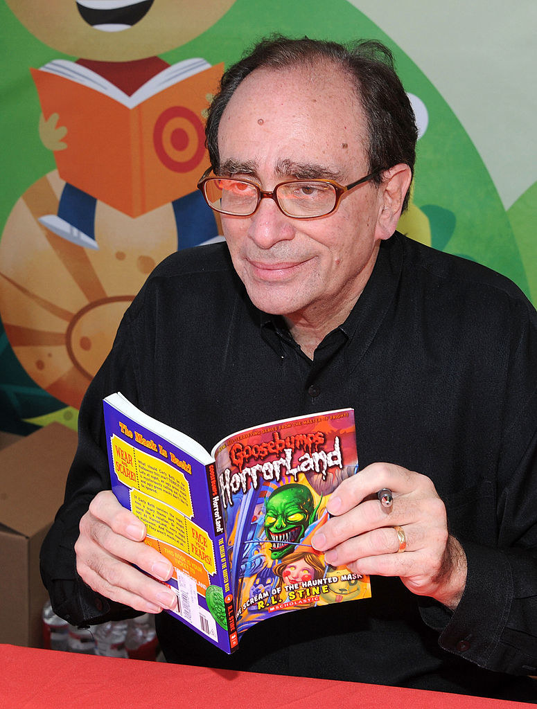 RL Stine holding one of his books