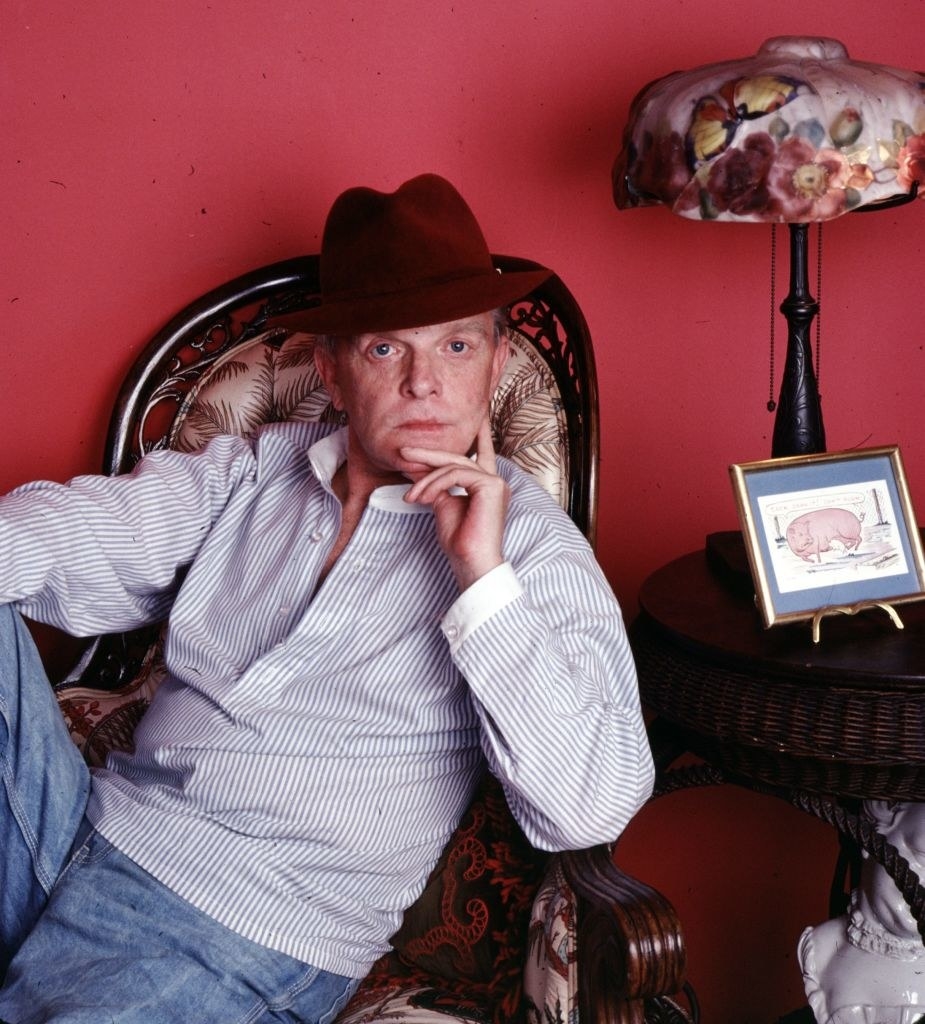 Truman Capote leaning in a chair
