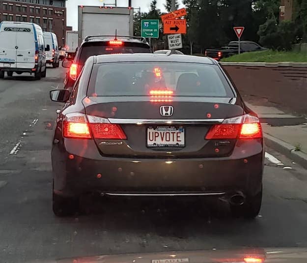 Car with license plate reading &quot;UPVOTE&quot;