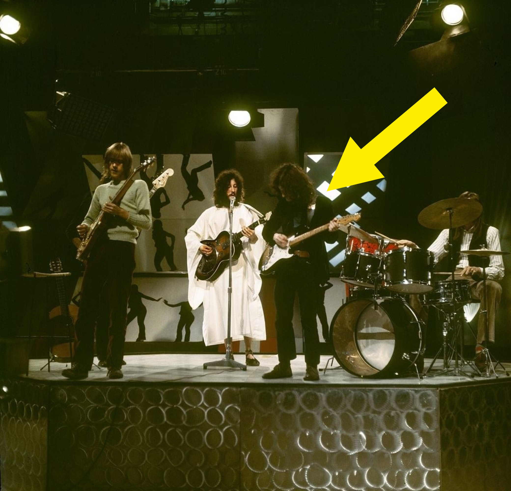 Fleetwood Mac onstage with an arrow pointing to Spencer