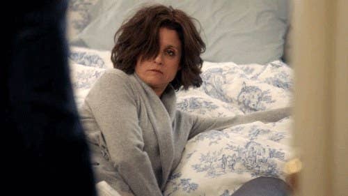 exhausted woman in bed