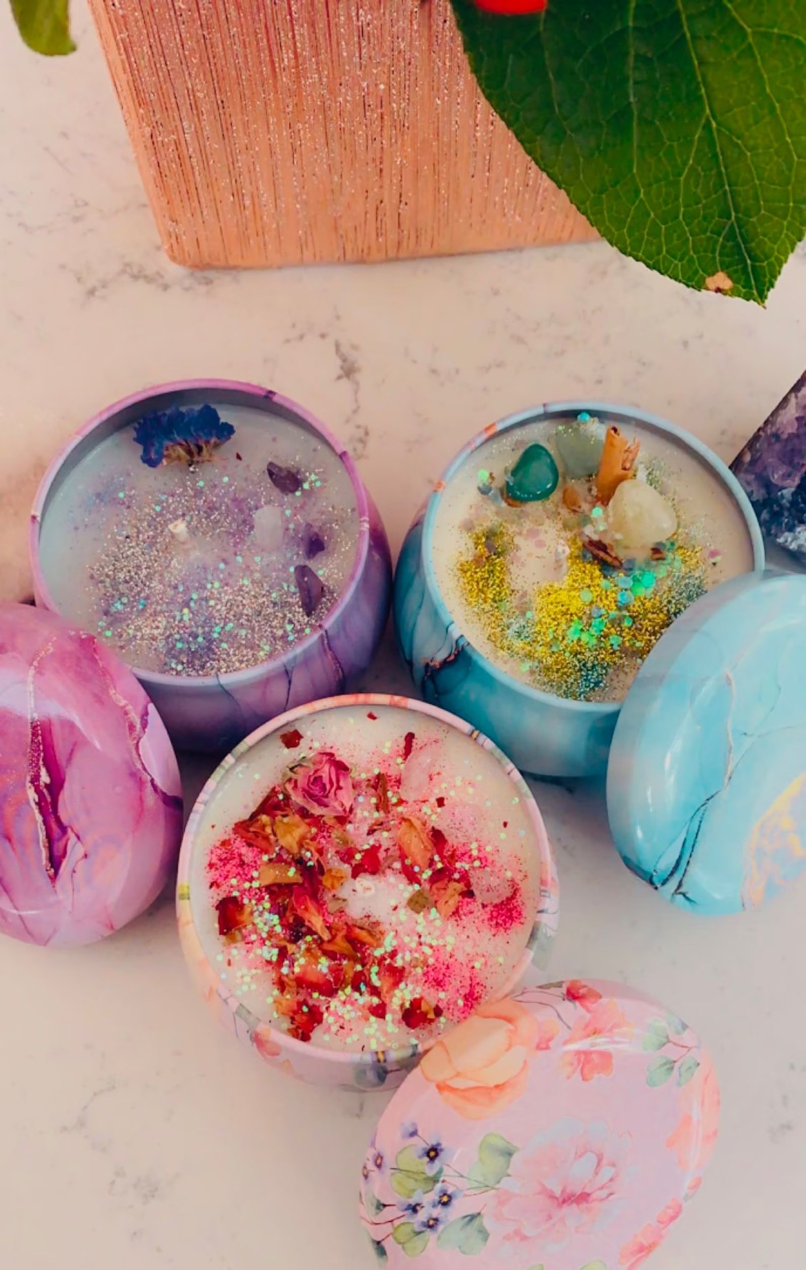 Colorful candles with crystals and glitter in them