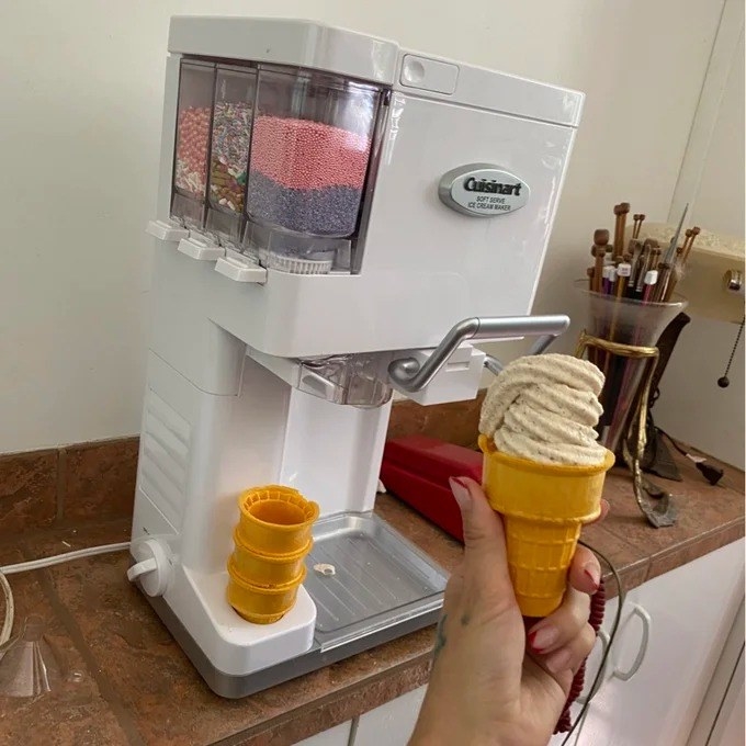 a reviewer photo the ice cream maker and a filled ice cream cone right in front