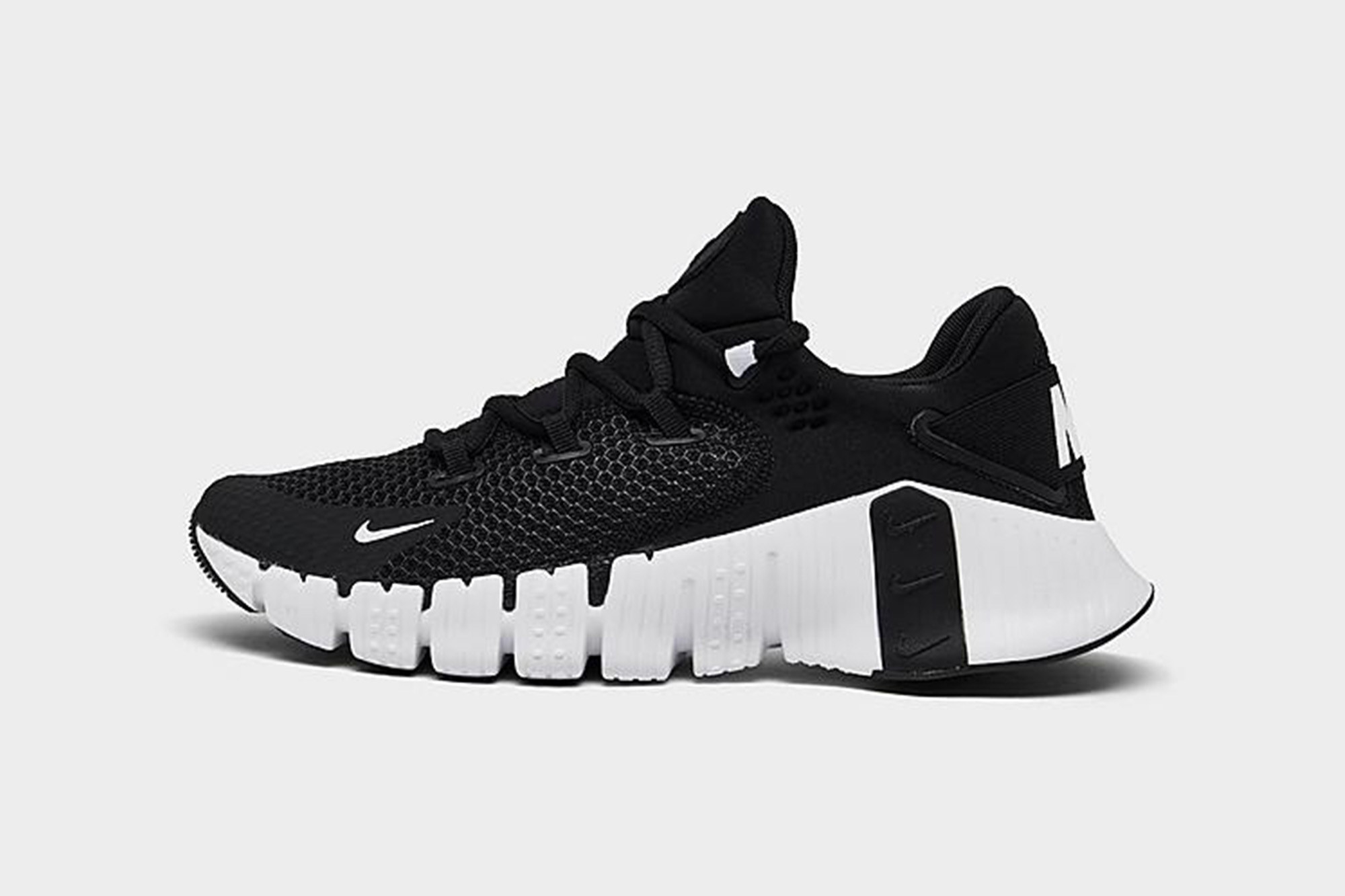black Nike shoes with a white, wavy sole