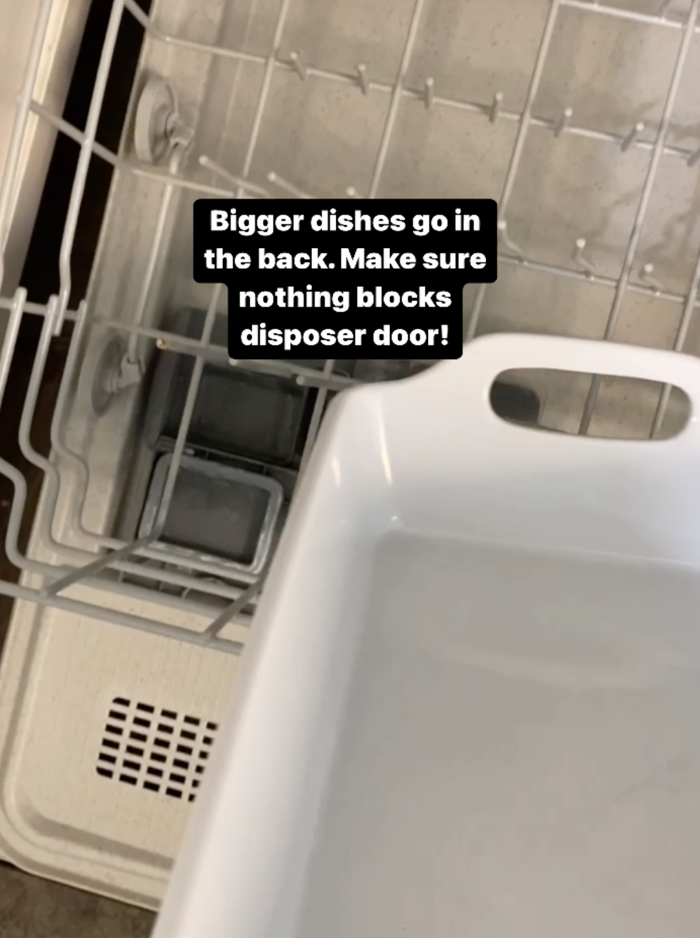 Bigger dishes go in the back; make sure nothing blocks the dispenser door!