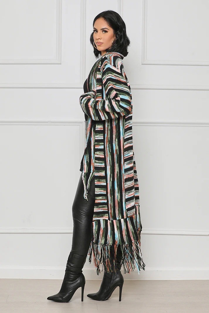model wearing the black multi-color fringe knit cardigan with black boots