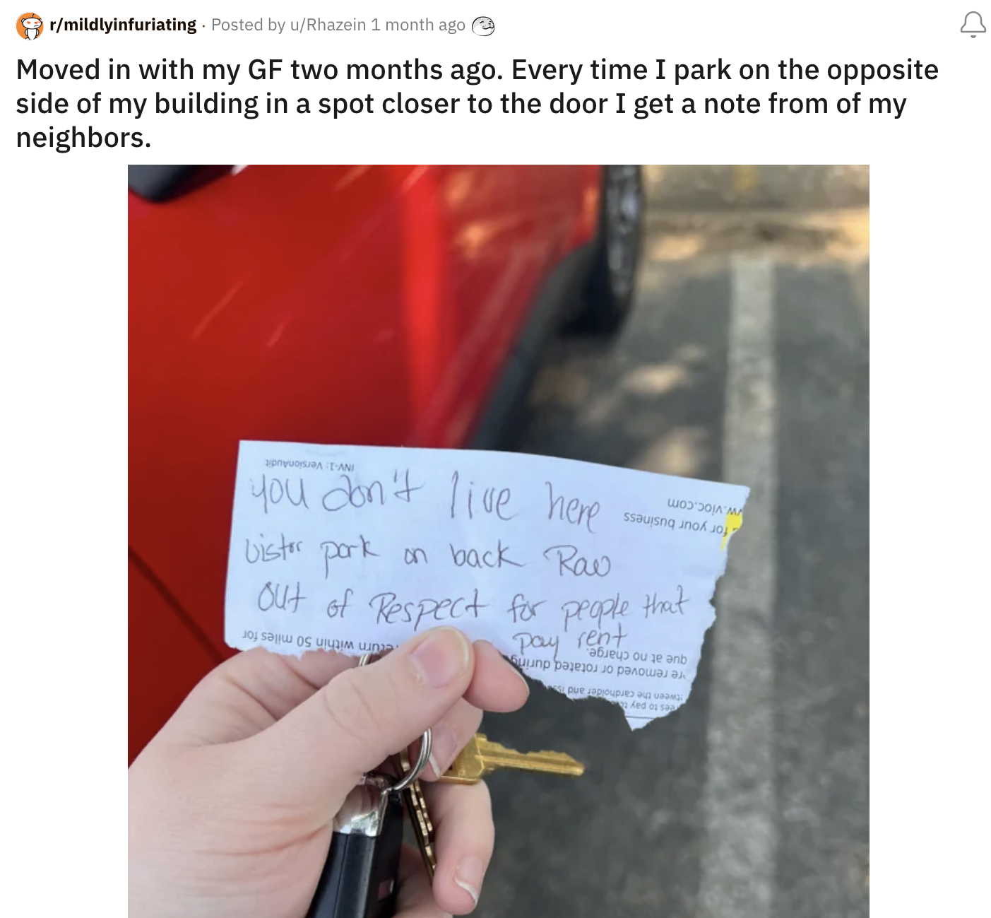 A man holding a note left by a neighbor