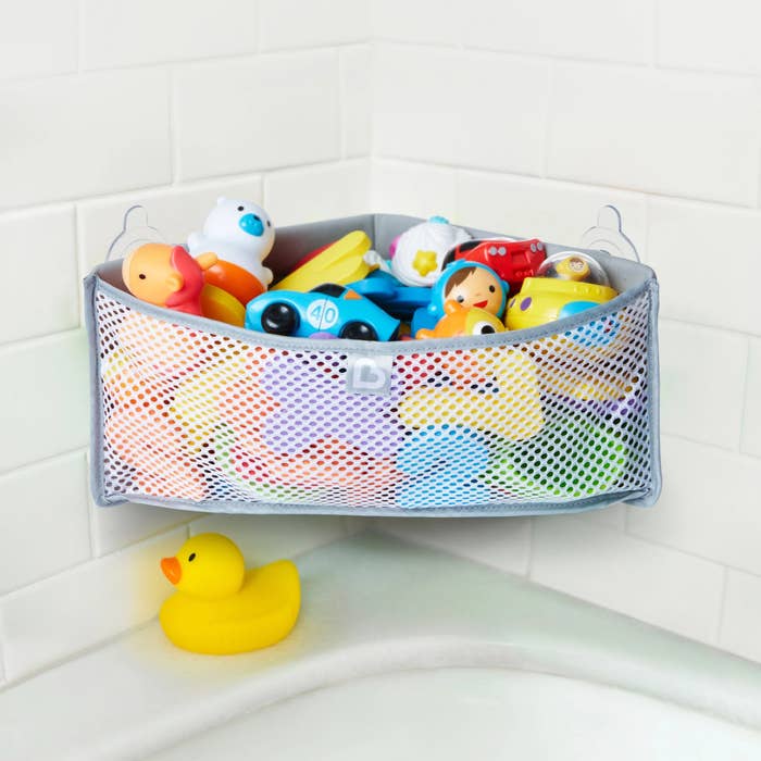 Toy organizer filled with toys in shower