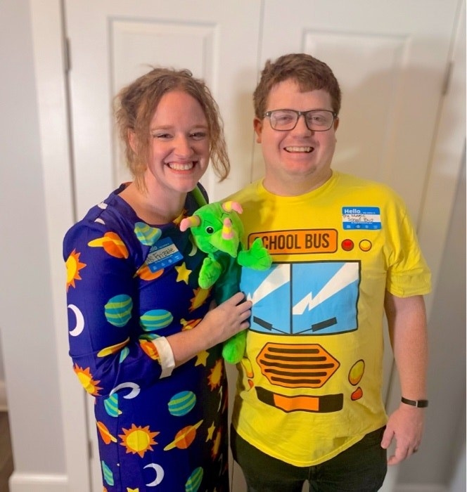 Someone dressed as Ms. Frizzle and another as the school bus