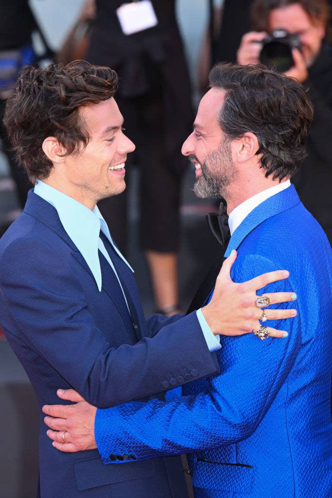 Nick Kroll and Harry Styles embracing