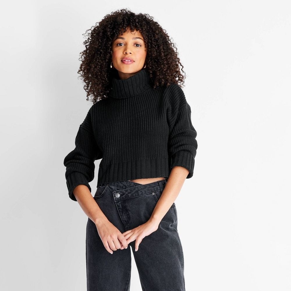 model wearing the turtleneck sweater in black
