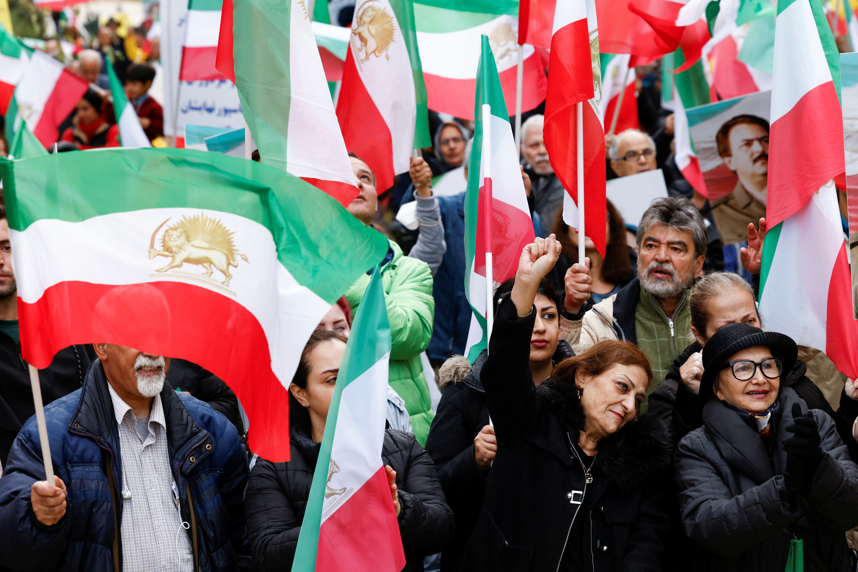 Protestors march amidst a sea of flags.