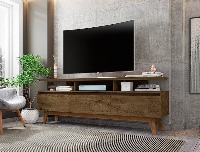 The brown wooden TV stand