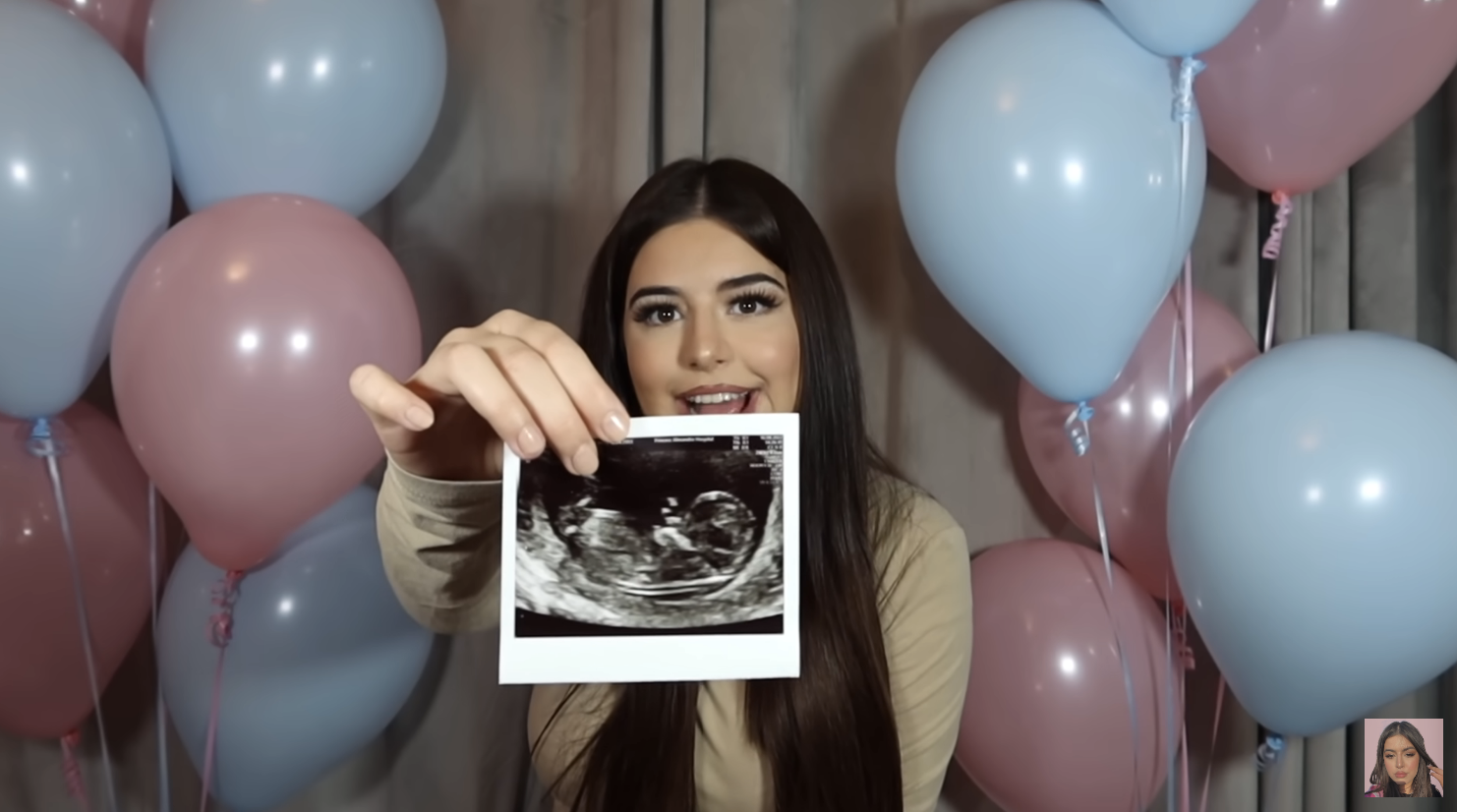 Sophia holding a sonogram photo