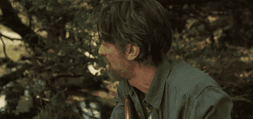 Sharlto Copley looking around the jungle in Beast