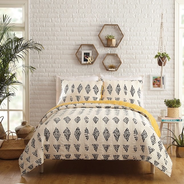 the black, white, and yellow quilt set