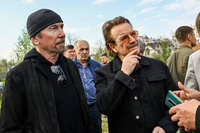 The Edge and Bono from U2 standing together