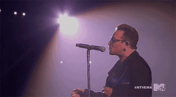 GIF of Bono singing into a microphone