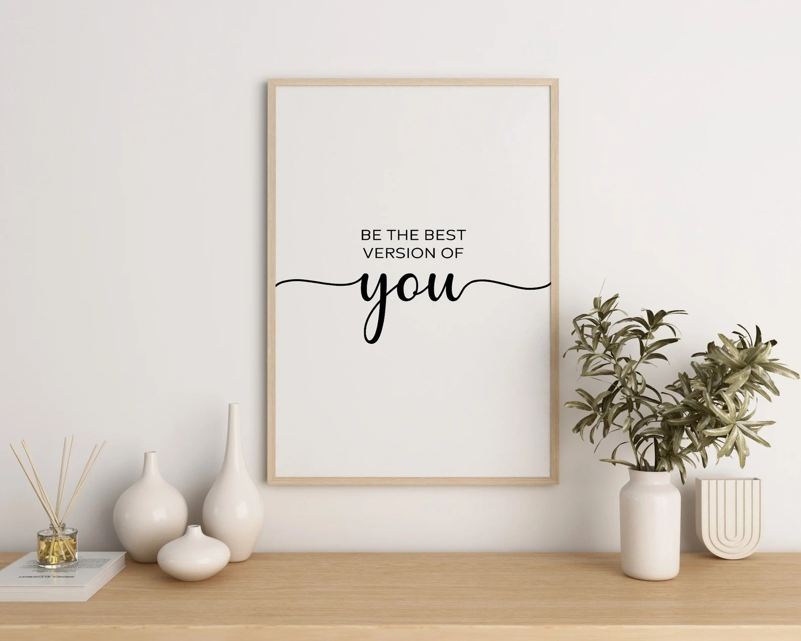 A framed quote on the wall that says &quot;be the best version of you&quot;