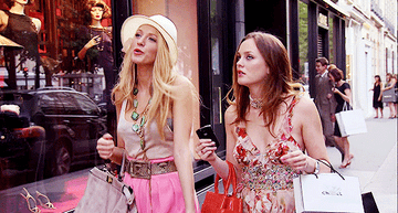 Serena and Blaire from &quot;Gossip Girl&quot; walking with shopping bags.