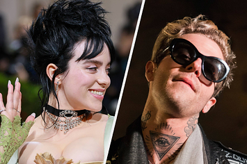 Billie Eilish wears a light green mesh dress with a black choker with her hair in an updo. Jesse Rutherford wears a black leather jacket with black sunglasses.