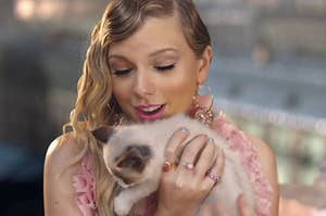 taylor swift holding a cat