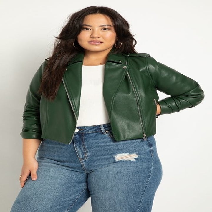 a model wearing a green moto jacket